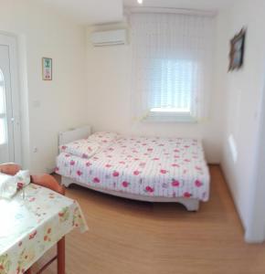 מיטה או מיטות בחדר ב-Apartment Gebic Ivan