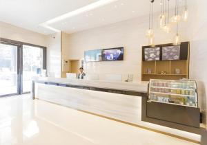 TV a/nebo společenská místnost v ubytování City Comfort Inn Foshan Shishan Square