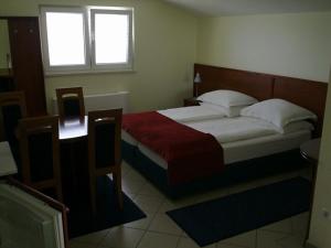 Postel nebo postele na pokoji v ubytování Apartments Vila Kristina