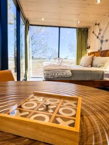 Ένα ή περισσότερα κρεβάτια σε δωμάτιο στο Andromeda at The Retreat