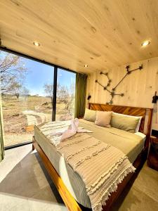 Ένα ή περισσότερα κρεβάτια σε δωμάτιο στο Andromeda at The Retreat