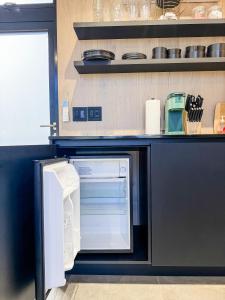 Η κουζίνα ή μικρή κουζίνα στο Andromeda at The Retreat +8 φωτογραφίες