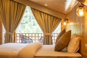 Postel nebo postele na pokoji v ubytování Hotel Patalsu