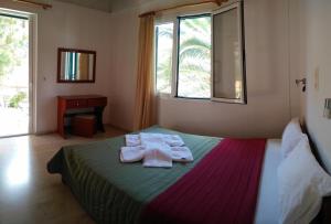 Ένα ή περισσότερα κρεβάτια σε δωμάτιο στο Michalis Place Apartments 