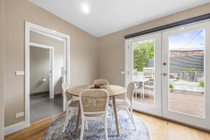 a dining room with a table and chairs at Lovely 3-Bed with Alfresco Dining in Prime Suburb in Ballarat