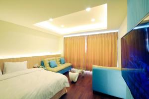 Katil atau katil-katil dalam bilik di 綠島 綠堤濱海旅店