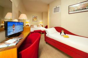 TV a/nebo společenská místnost v ubytování Hotel Kursaal