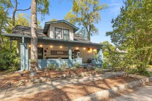 a home in the woods with a tree at *Super close to Hospitals|UAB|Open fl plan|2 bdr in Birmingham