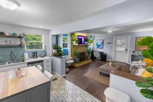 a kitchen and living room with a couch and a table at *Super close to Hospitals|UAB|Open fl plan|2 bdr in Birmingham