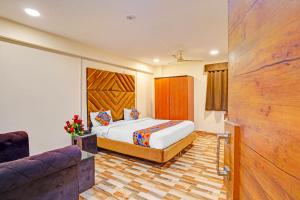 Ένα ή περισσότερα κρεβάτια σε δωμάτιο στο Hotel Nandlala Stays