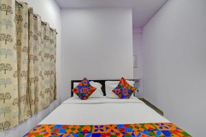 Ένα ή περισσότερα κρεβάτια σε δωμάτιο στο Hotel Udaan Villa