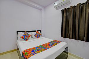 Ένα ή περισσότερα κρεβάτια σε δωμάτιο στο Hotel Udaan Villa