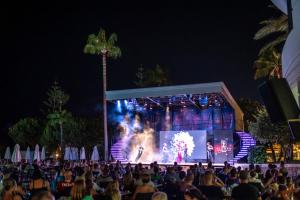 a crowd of people watching a concert at night at Iz Flower Side Beach Hotel in Side +224 photos