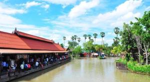 a group of people standing next to a river at Seksub Place in Ban Han Tra Fang Nua