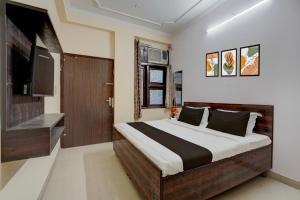 Ένα ή περισσότερα κρεβάτια σε δωμάτιο στο Hotel O Jagatpura Central Railway Station Jaipur