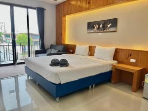 Postel nebo postele na pokoji v ubytování The Coco Grand Chalet Pakbara