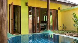 a swimming pool in front of a house at Aroma Pai Spa Hotel in Ban Tha Pai +164 photos