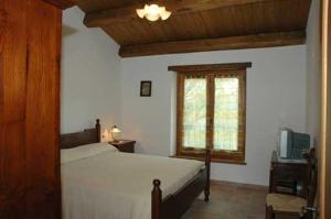 A bed or beds in a room at Agriturismo Il Falco del Monte Fumaiolo