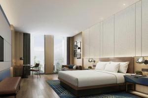 Postel nebo postele na pokoji v ubytování Four Points by Sheraton Kunshan + 30 fotografií