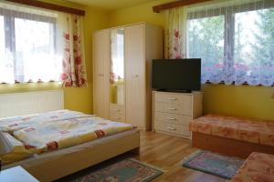 Llit o llits en una habitació de Penzion Jaraba