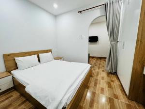 Postel nebo postele na pokoji v ubytování T-House 304