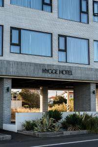 a building with the name of an image hotel at Hygge Hotel in Seogwipo
