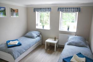 Posteľ alebo postele v izbe v ubytovaní Apartment Ptačí Dům