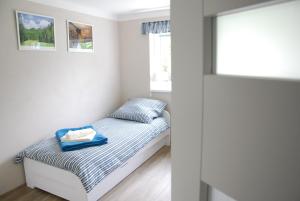 Posteľ alebo postele v izbe v ubytovaní Apartment Ptačí Dům