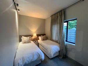 Ένα ή περισσότερα κρεβάτια σε δωμάτιο στο Stay on Main 2