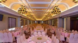 a banquet hall with white tables and white chairs at Jinjiang Metropolo Shanghai Minhang in Shanghai