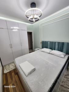 Giường trong phòng chung tại Tashkent International Aeroport +3 ảnh