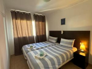 Ένα ή περισσότερα κρεβάτια σε δωμάτιο στο San Agustin Ocean View +21 φωτογραφίες