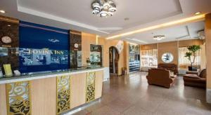 a lobby of a hotel with a bar and a waiting room at Lovina Inn Penuin Hotel in Nagoya