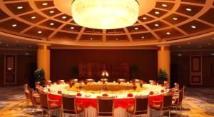 a large table in a room with chairs and a chandelier at Changshu Jinling Tianming Grand Hotel in Changshu +171 photos
