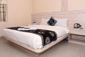 Ένα ή περισσότερα κρεβάτια σε δωμάτιο στο The KIWWI Hotel +30 φωτογραφίες