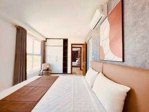 a bedroom with a bed in a room with a window at Homestay NewLife Bãi Cháy in Ha Long +93 photos