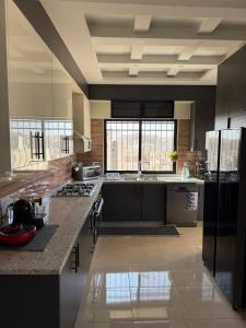 Kuchyň nebo kuchyňský kout v ubytování Sports city 2bd room