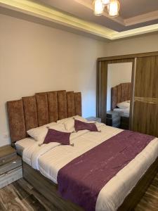 Postel nebo postele na pokoji v ubytování Sports city 2bd room