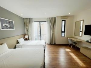 Ένα ή περισσότερα κρεβάτια σε δωμάτιο στο Homestay Hạ Long NewLife +59 φωτογραφίες