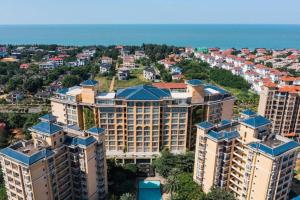 an aerial view of a city with tall buildings at Da Peng Zhongzhou Hotel in Haikou