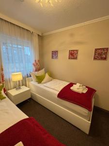 Ένα ή περισσότερα κρεβάτια σε δωμάτιο στο Baden-Chalet