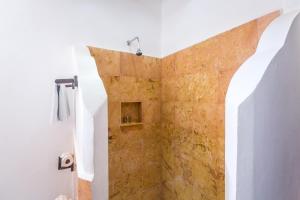 a bathroom with a toilet and a sink at Holbox Dream Beachfront Hotel in Holbox Island