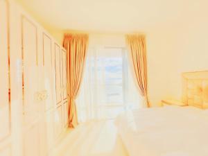 Postel nebo postele na pokoji v ubytování 晨曦公寓酒店