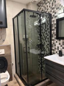 Ванная комната в IN Apartman, Župa Kopaonik +19 фотографий