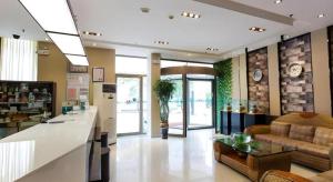 a lobby of a store with a couch and a table at Jinjiang Inn Zibo People's Park Liuquan Road in Zibo