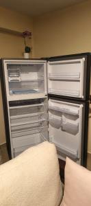 Postel nebo postele na pokoji v ubytování Ebony 1br Nanyuki town