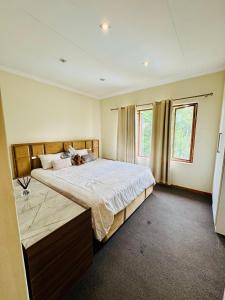 Ένα ή περισσότερα κρεβάτια σε δωμάτιο στο Gem in the heart of Sandton