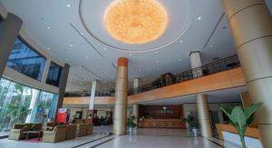 a large lobby with a large light in the ceiling at Vientiane Plaza Hotel in Vientiane
