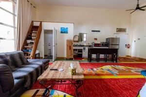 a living room with a couch and a table at Santuario Grande in Los Ranchos de Albuquerque