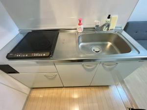 Η κουζίνα ή μικρή κουζίνα στο 411札幌駅7分と大通駅徒歩6分で好立地な都心を満喫でき綺麗な部屋で快適が生活が実現 +31 φωτογραφίες